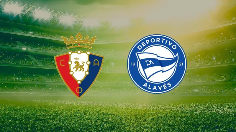 Cầu thủ của Osasuna dùng kỹ thuật cá nhân để vượt qua cầu thủ Alavés trên sân cỏ